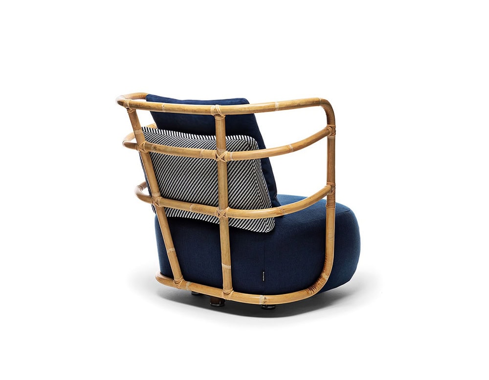 Jungle Armchair Slim upholstered in blue fabric and brown wooden structure on a white background.