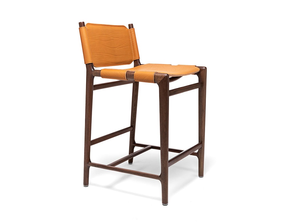 Levante Stool. Structure in brown wood, seat and backrest in orange leather on a white background.