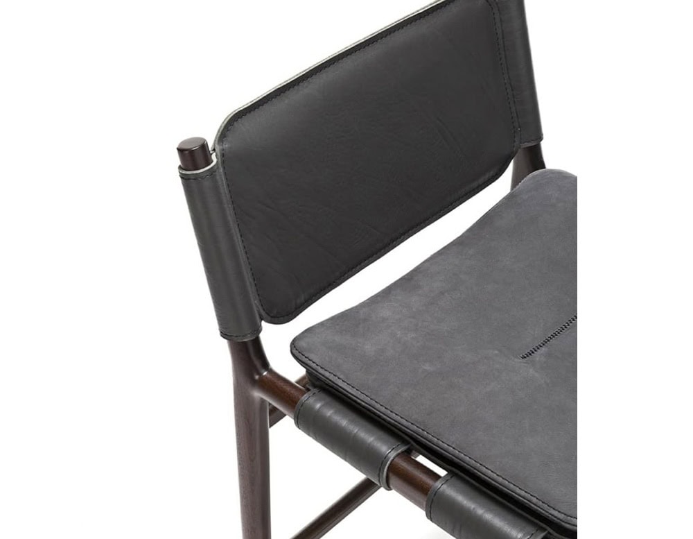 Levante Stool. Structure in brown wood, seat and backrest in gray leather and gray cushion on a white background.