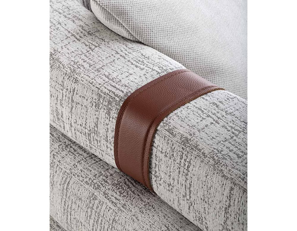 Closeup of Panarea Sofa in gray and brown fabric with backrest on a white background.