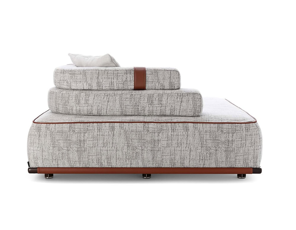 Panarea Sofa in gray fabric with backrest and cushions o a white background.