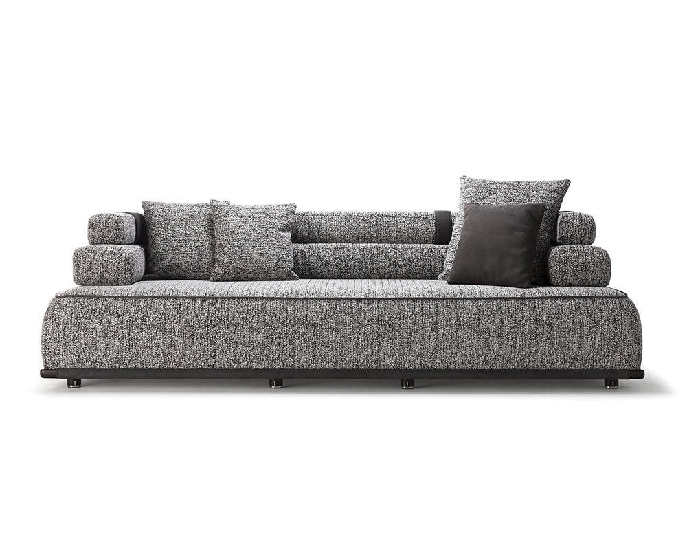 Panarea Sofa in gray fabric with backrest and cushions o a white background.