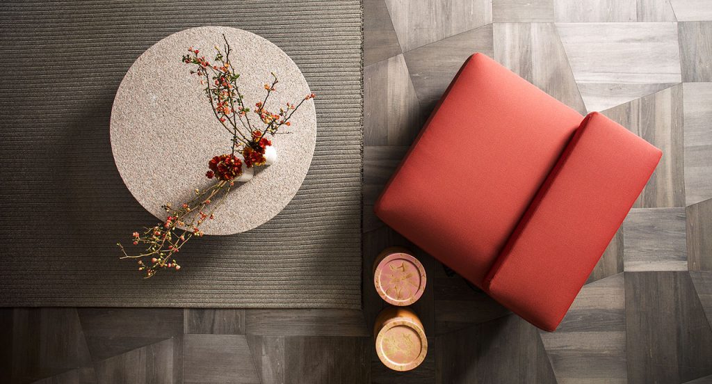 Agio Modular sofa composed of large platforms, backrest can be adjusted, all upholstered in red fabric in a living room.