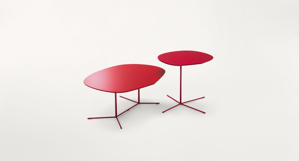 Two red Ivy side tables, base in steel, top in fibreboard on a white background.