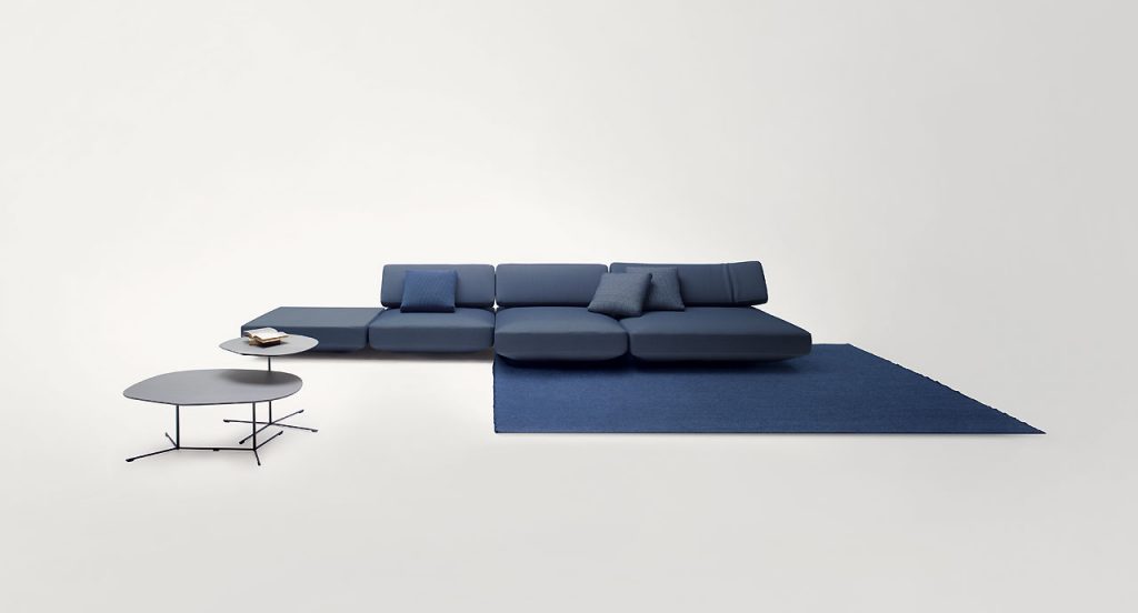 Two black Ivy side tables, base in steel, top in fibreboard in a living room.