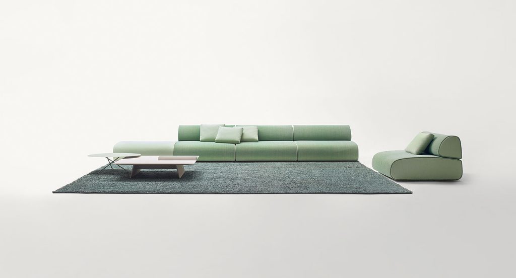 Kanji Coffee Table, top in natural wood and white metal tray, two legs in natural wood in a living room.