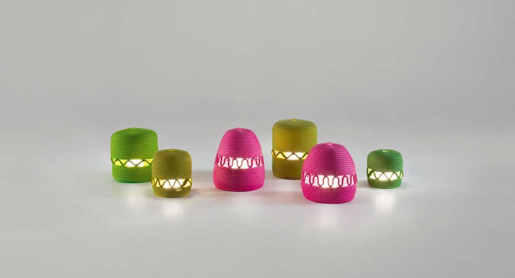 Six led Agadir lanterns made of rope cord in a spiral-like pattern, two in pink, two in yellow and two in green on a white background.