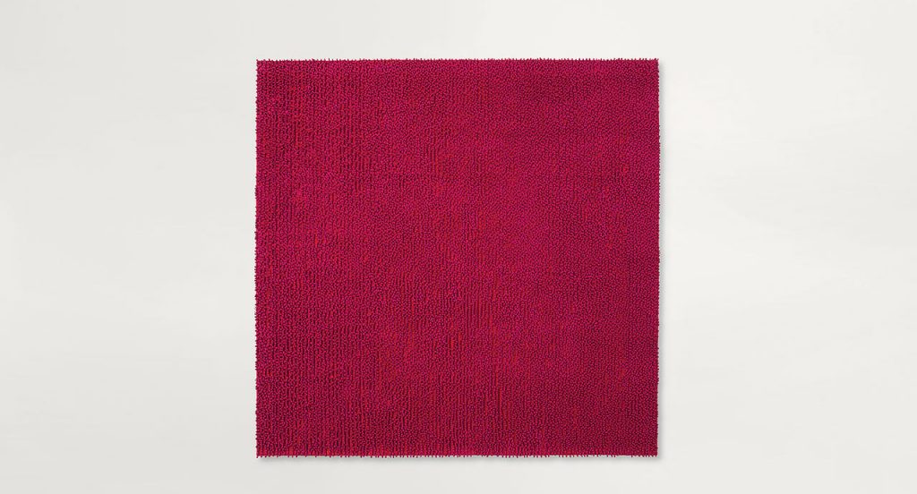 Air rug, texture of pink boucle stitches made of rope braid on a white background.