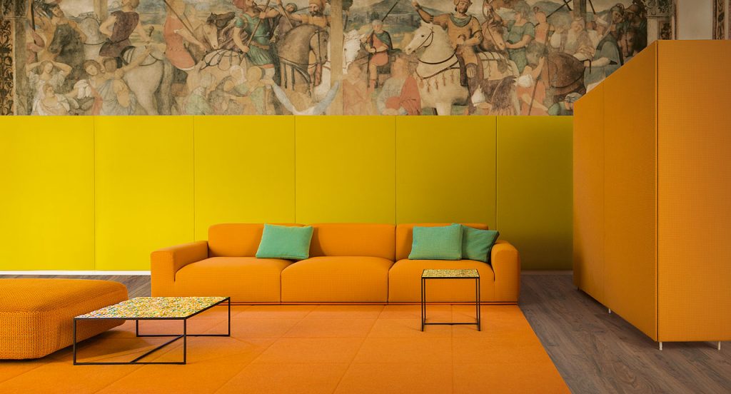 Two Cocci side tables, black steel frame, brown, orange, green and white square ceramic top in a living room.
