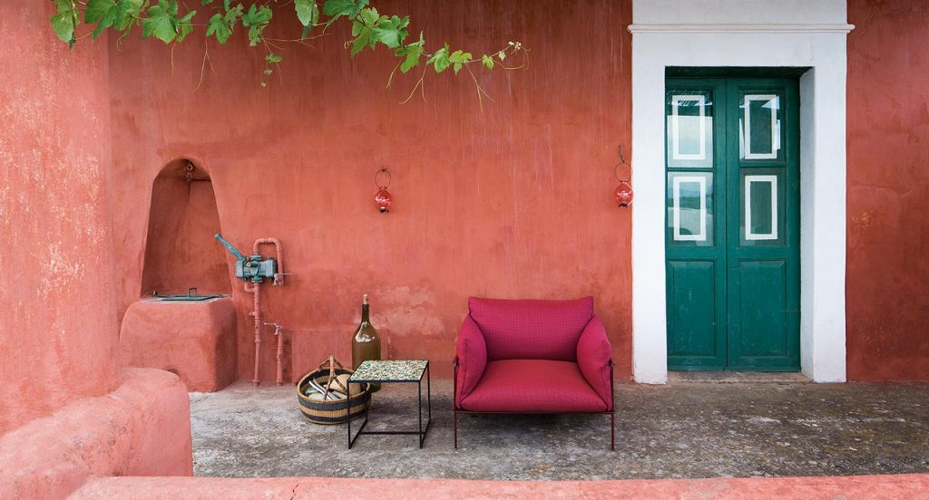 Cocci side table, black steel frame, green and white square ceramic top in a terrace.