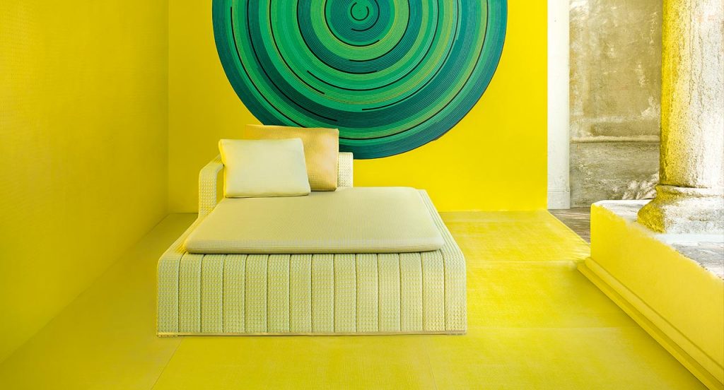 Yellow Frame Chaise, upholstey of rope braids, seat pad and cushion in a terrace.