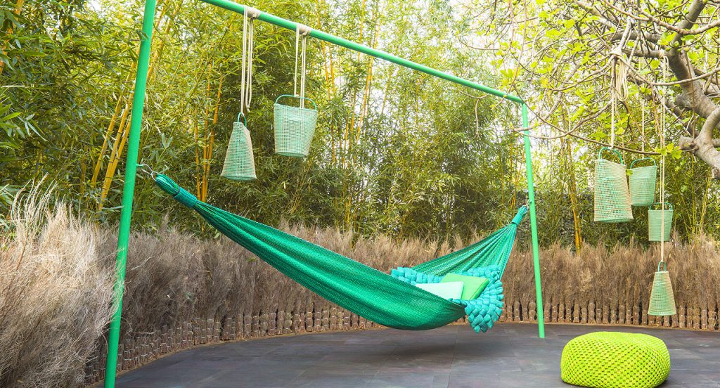 Six Lanternas, structure in green steel, cover in green brige kimia fabric in a terrace.