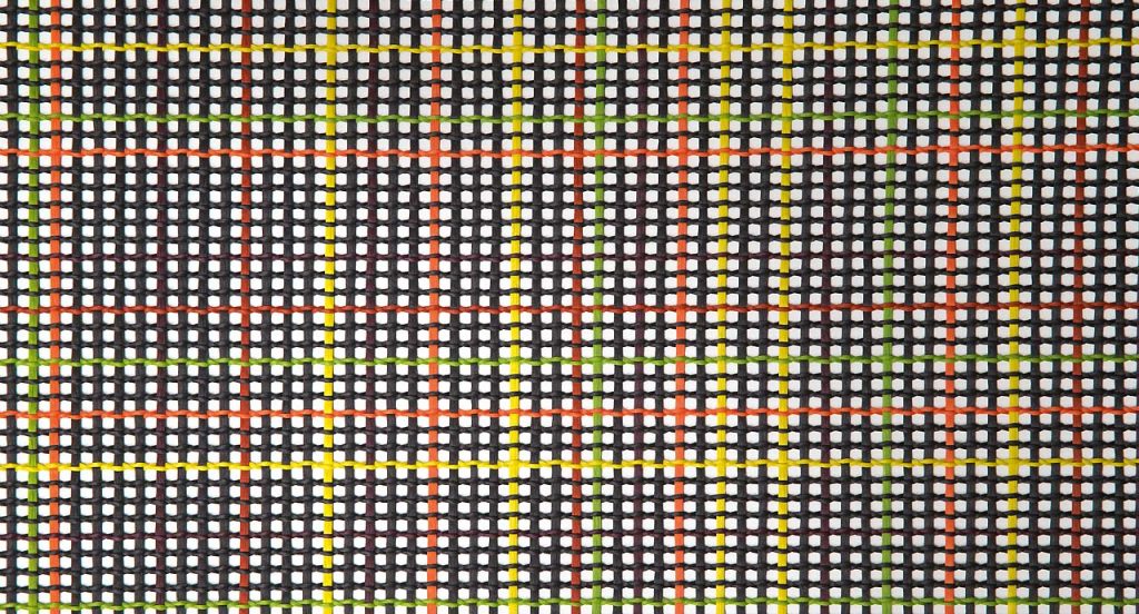 Nilo rug in black, orange, red, tellow and green kimia fabric on a white background.