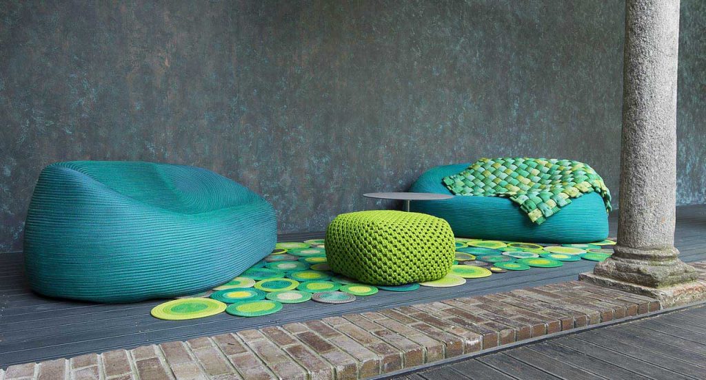 Two Otto Sofas upholstery made of blue rope cord in a living room.