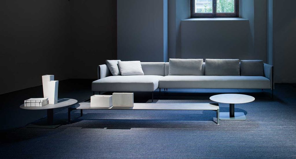 Samo rug made of grey rope cords and irregular shape in a living room.