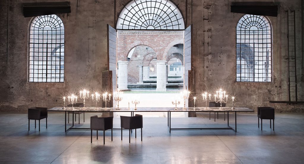 Grey, white and brown Sciara Dining Table, structure and two legs in black steel, top in lava stone in a dining room.