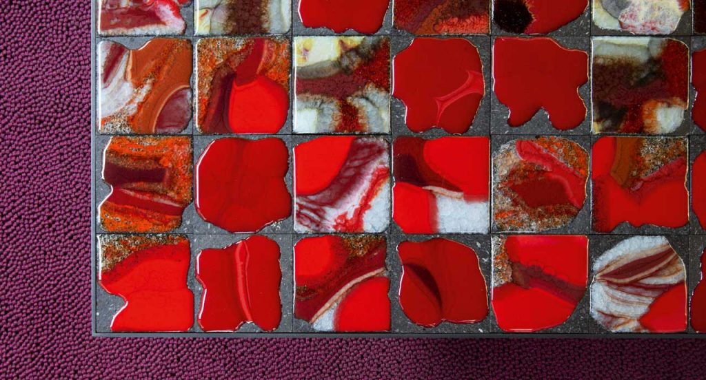 Red ara Side Table, structure in black steel, top in lava stone.