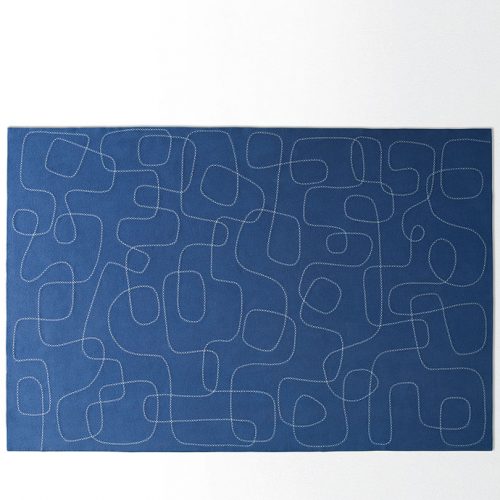 Blue and white Script rug, abstract script like pattern in wool on a white background.