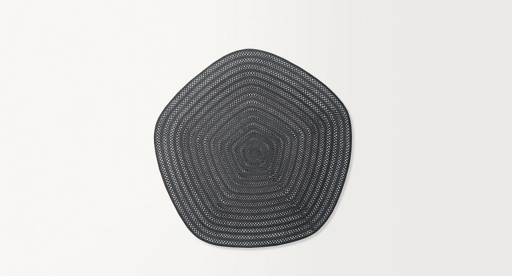 Pentagonal Shang Rug, grey cord in zig zag like pattern on a white background.