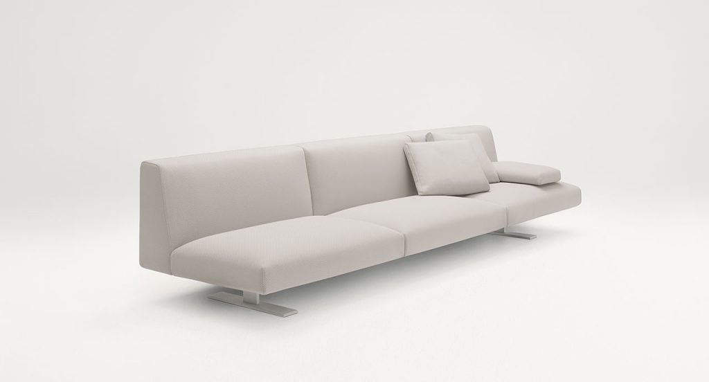 Three seater Move Sofa, upholstered in white fabric, two legs in steel on a white background.