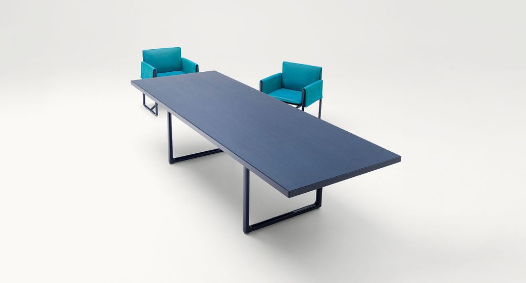 Portofino Indoor Dining Table, Structure and two legs in black steel, top in blue fibreboard in a dining room.