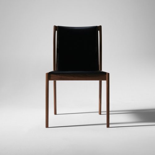 chair made of brown wood and leather in a black tone on a white background