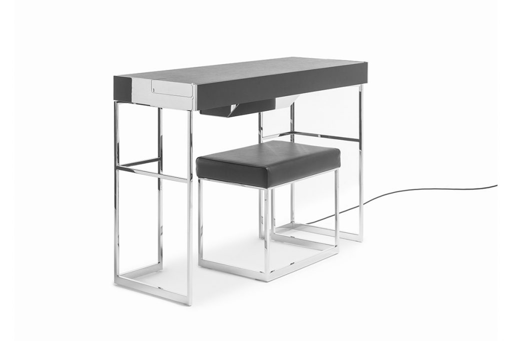 desk made of stainless steel base drawers in leather of a black color tone on a white background