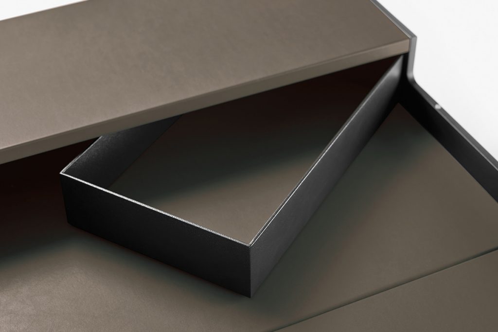 desk drawers made of black leather and wood on a white background
