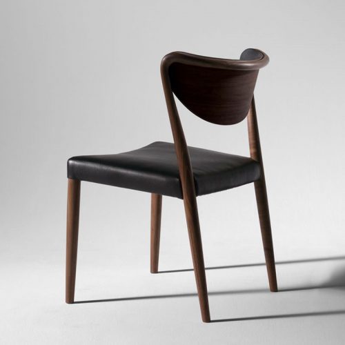 chair with opening made of brown walnut wood base and upholstered in black leather on a white background