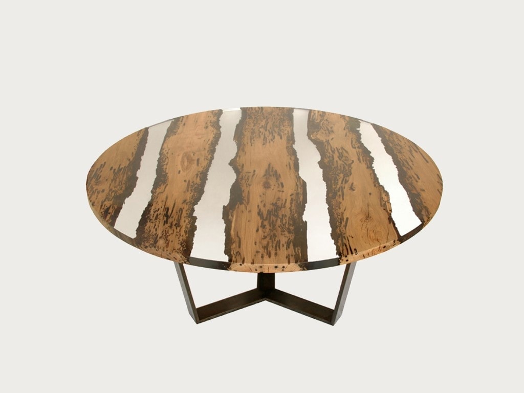 Chimenti Round Table with a circular shape, made of solid wood with a natural finish and featuring a transparent resin inlay, set against a white background.