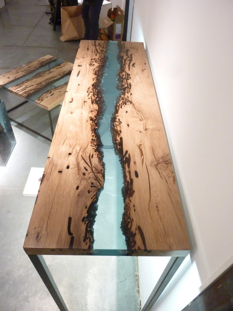 Canal Console with a rectangular shape, made of solid wood with a natural finish and featuring a transparent resin inlay, set against a white background.