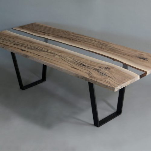 Creek Table with a rectangular shape, made of solid walnut wood with a natural finish and featuring a transparent resin inlay, set against a white background.