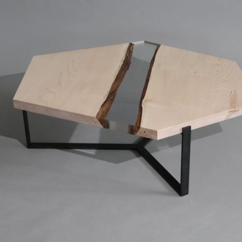 Crystal Maple Low Table with a polygonal shape, made of solid maple wood with a natural finish and featuring a transparent resin inlay, set against a white background.