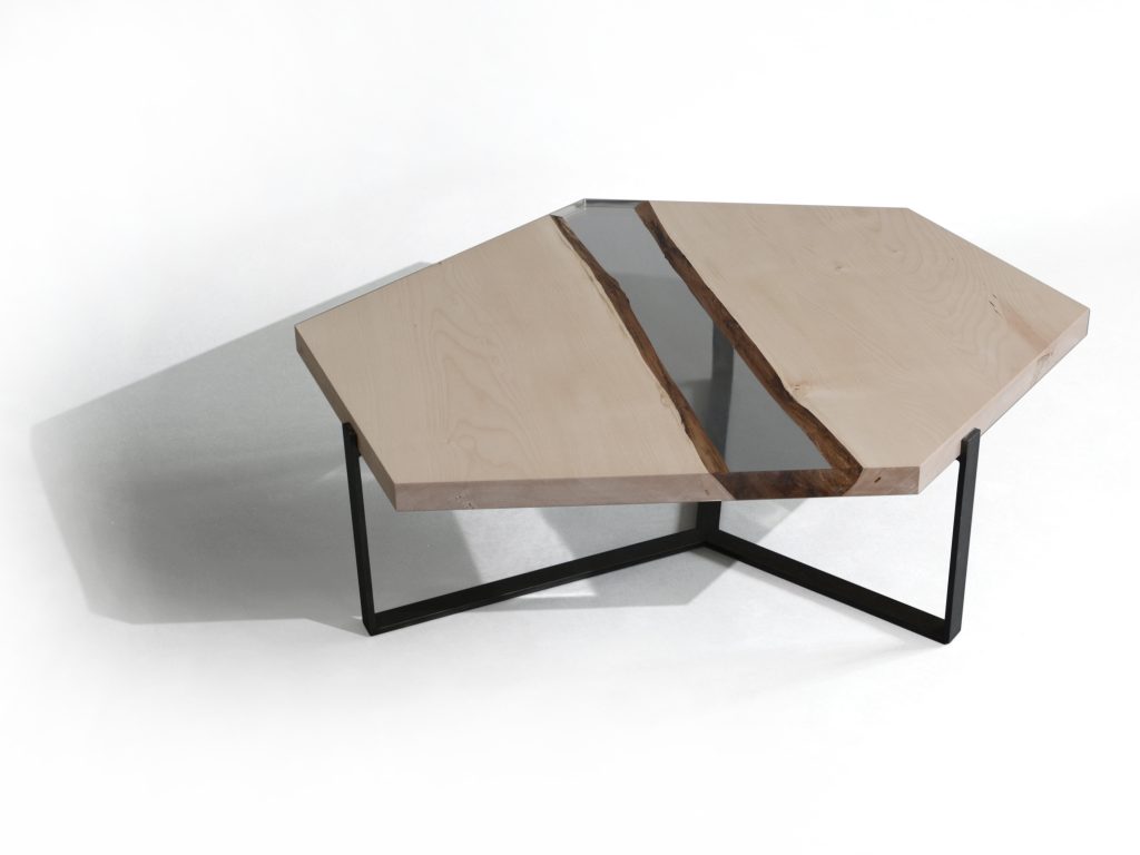 Crystal Maple Low Table with a polygonal shape, made of solid maple wood with a natural finish and featuring a transparent resin inlay, set against a white background.