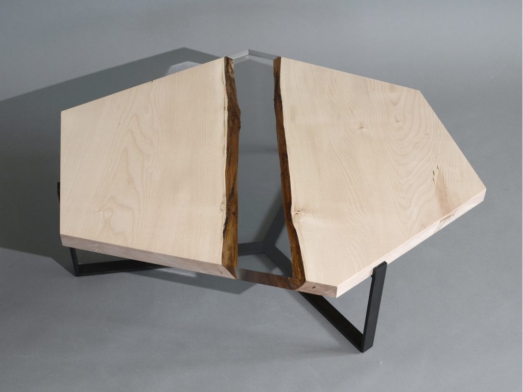 Crystal Maple Low Table with a polygonal shape, made of solid maple wood with a natural finish and featuring a transparent resin inlay, set against a white background.