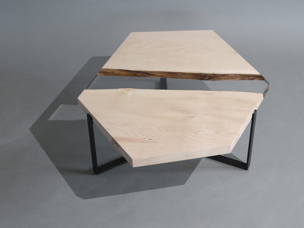 Crystal Maple Low Table with a polygonal shape, made of solid maple wood with a natural finish and featuring a transparent resin inlay, set against a white background.