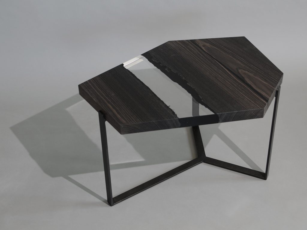 Crystal Peatwood Low Table with an polygonal shape, made of solid peatwood with a natural finish and featuring a transparent resin inlay, set against a white background.