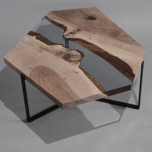 Crystal Walnut Low Table with a polygonal shape, made of solid walnut wood with a natural finish and featuring a transparent resin inlay, set against a white background.