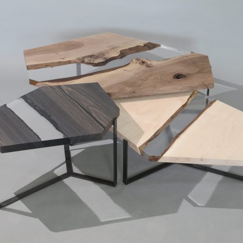 Crystal Wood Trio Low Tables featuring three tables with polygonal shapes, made of solid wood with natural finishes and transparent resin inlays, on a white background.