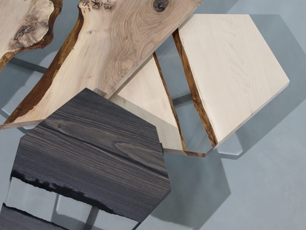 Crystal Wood Trio Low Tables featuring three tables with polygonal shapes, made of solid wood with natural finishes and transparent resin inlays, on a white background.