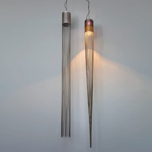 Two suspended lighting sculptures in satin stainless steel in a transparent brown tone on a white background