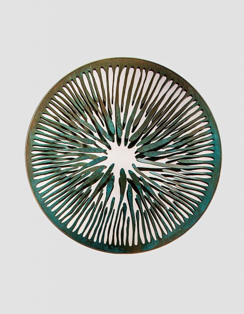 sculptural mirror made of aluminum, graphite brass, bronze, steel or iron in a green with brown tone