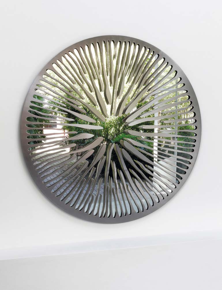 sculptural mirror made of aluminum, graphite brass, bronze, steel or iron in a green, gray and yellow tone