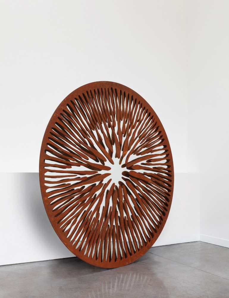 sculptural mirror made of aluminum, graphite brass, bronze, steel or iron in a red tone