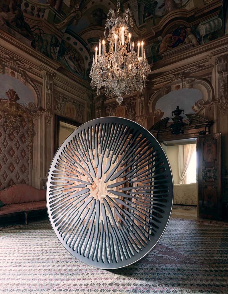 sculptural mirror made of aluminum, graphite brass, bronze, steel or iron in a gray tone
