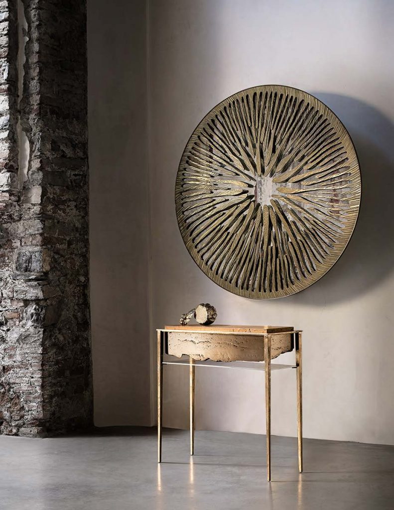 sculptural mirror made of aluminum, graphite brass, bronze, steel or iron in a golden tone