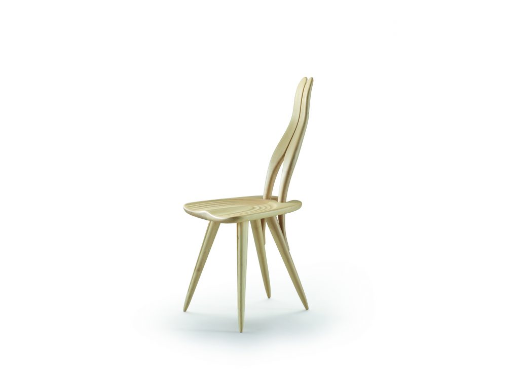 Fenis chair with a natural wooden frame, rabbit ears like shape back on a white background.