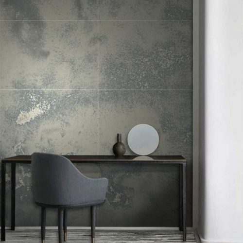 Parallel mosaic in gray with rectangular patterns, set against a wall.