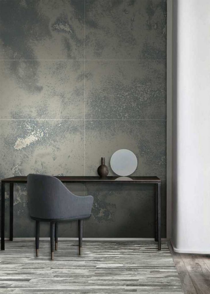 Parallel mosaic in gray with rectangular patterns, set against a wall.