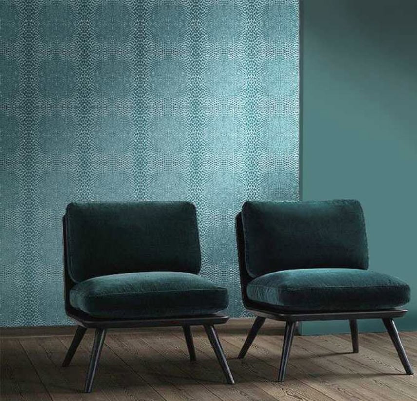Pure Mosaic in shades of blue with square patterns, set against a wall.